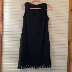 Black sleeveless dress with tassels